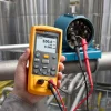 The Fluke 714B is a handheld, battery-operated instrument that measures and sources a variety of thermocouple types and millivolts. It can calibrate a linear thermocouple transmitter with the mV source function and also measure mA while sourcing temperature. It also provides linear ramp and 25% step auto ramp functionality based on 0% and 100% settings for performing quick, linearity checks. With the intelligent shutdown feature the Fluke 714B remembers settings when powered down so you can quickly replicate tests after powering back up. The calibrator also has one-year and two-year specifications, along with a traceable certificate of calibration. Combine that with its rugged construction, a backlit display, and easy to use interface and you have an ideal test tool for temperature calibration professionals who want a highly accurate, single-function thermocouple temperature calibrator.